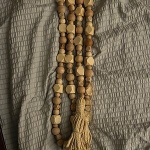 Solid Wooden Beaded Garland with Tassels 
One set.  6 feet Holiday Time
